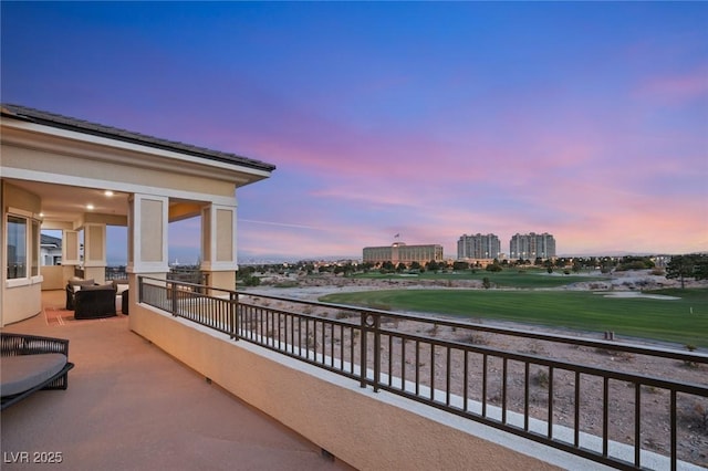 view of balcony at dusk