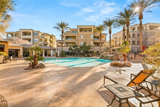 view of swimming pool featuring a patio area and pool water feature