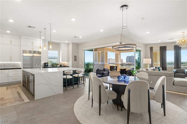 dining area featuring a notable chandelier