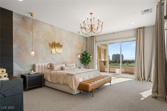 bedroom featuring carpet flooring, access to exterior, and a notable chandelier