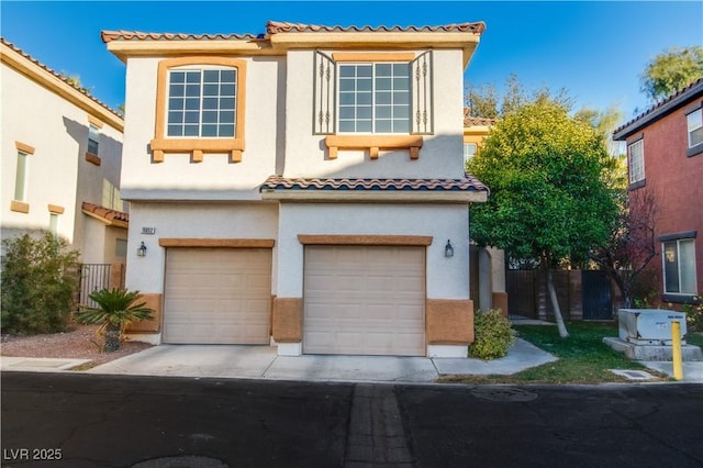 mediterranean / spanish-style home featuring a garage