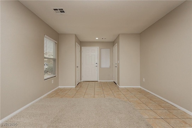 interior space featuring light tile patterned floors