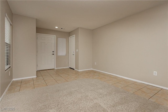 unfurnished room with light tile patterned floors