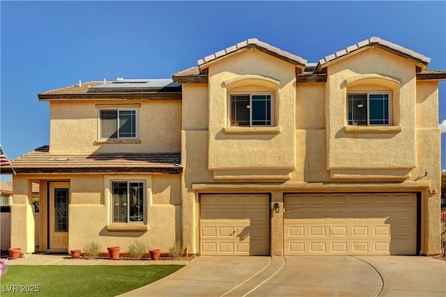 view of front of house with a garage and solar panels