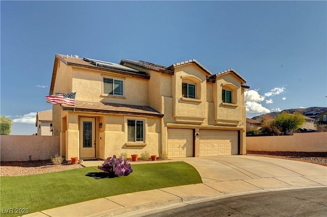 mediterranean / spanish house featuring a garage, a front yard, and solar panels