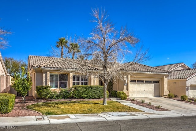 view of front of home with a garage and a front yard