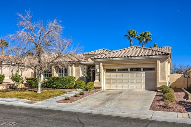 mediterranean / spanish-style house featuring a garage