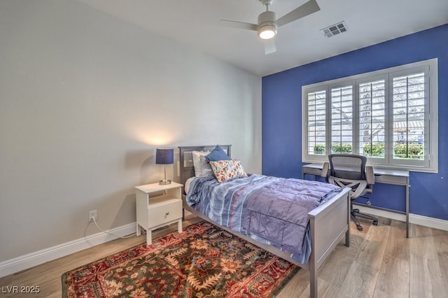 bedroom featuring ceiling fan and light hardwood / wood-style floors