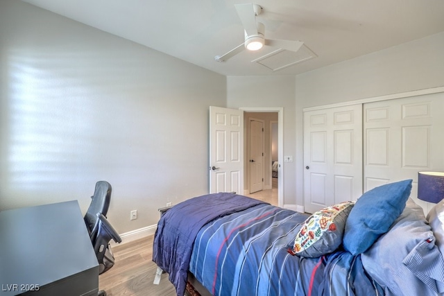 bedroom featuring a closet, ceiling fan, and light wood-type flooring