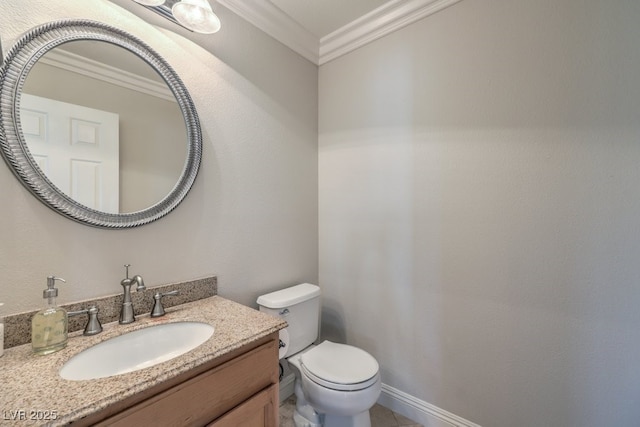 bathroom featuring vanity, crown molding, and toilet