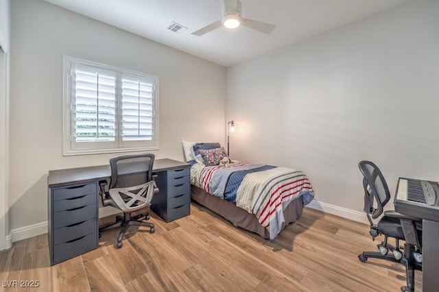 bedroom with ceiling fan and light hardwood / wood-style floors