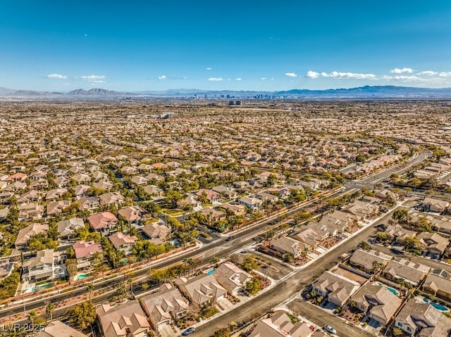 birds eye view of property with a mountain view