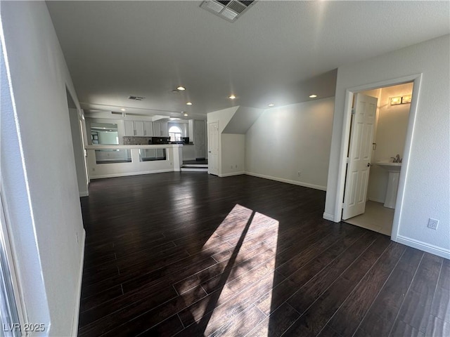 unfurnished living room with dark hardwood / wood-style floors