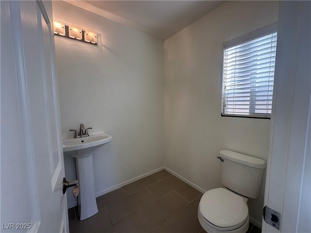 bathroom with sink and toilet