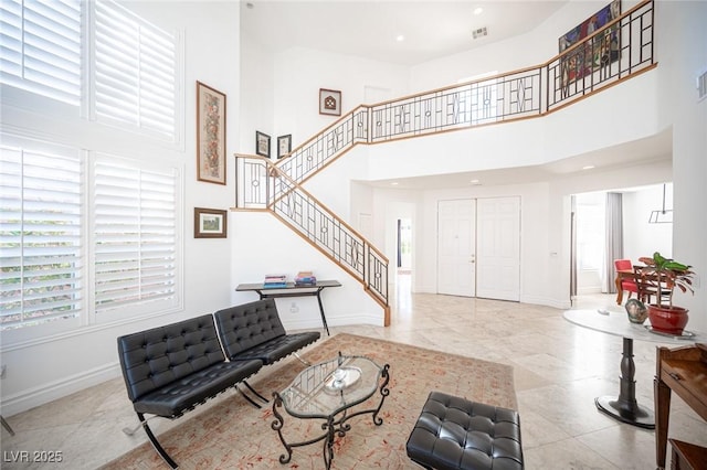 living room with a high ceiling