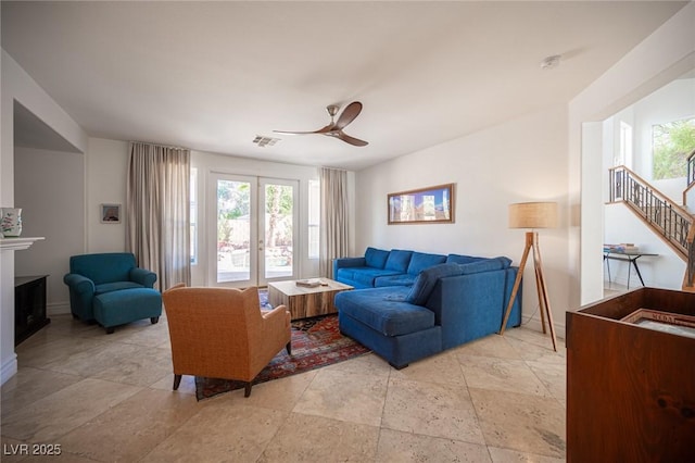 living room with french doors and ceiling fan