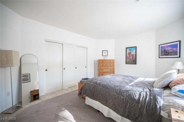 carpeted bedroom featuring a closet