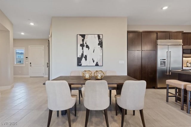 dining room with light tile patterned flooring