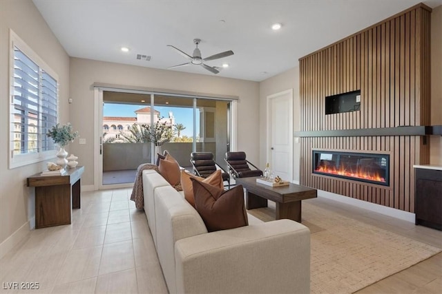 tiled living room featuring ceiling fan