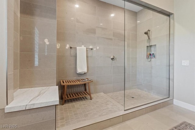 bathroom with a tile shower