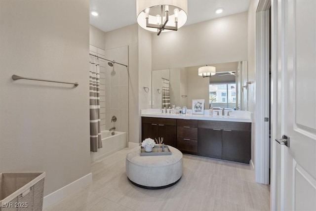 bathroom with shower / tub combo with curtain, vanity, and a chandelier