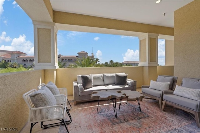 view of patio featuring a balcony and an outdoor hangout area