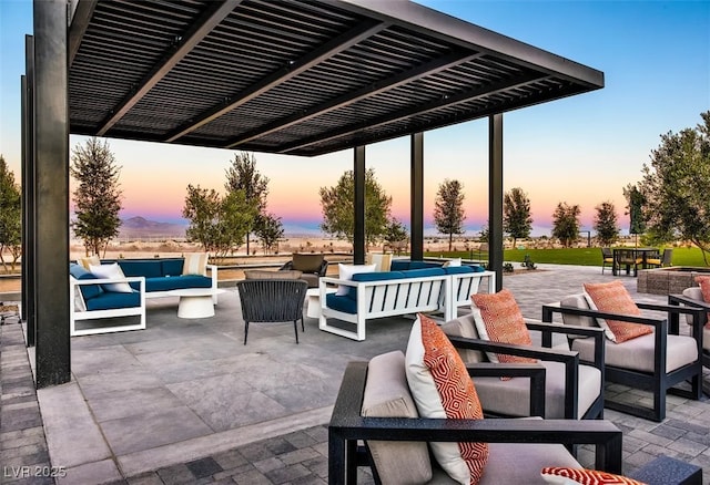 patio terrace at dusk with an outdoor hangout area, outdoor dining area, and a pergola