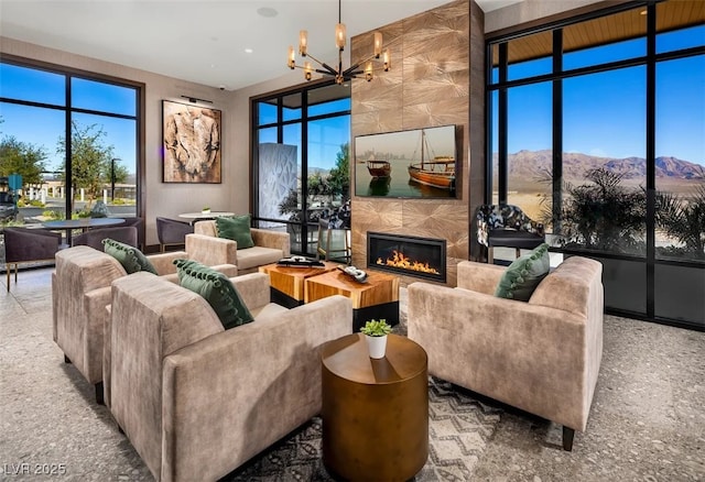 interior space with a notable chandelier and a fireplace