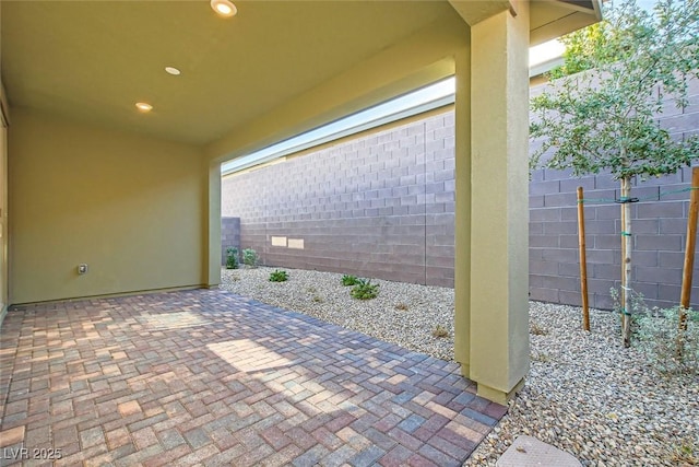 view of patio / terrace featuring fence