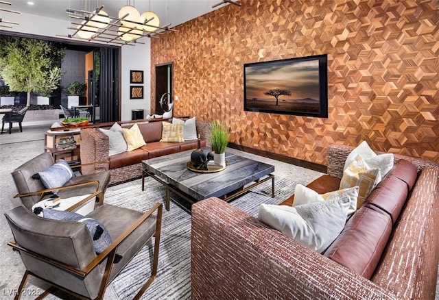 interior space featuring baseboards and a notable chandelier