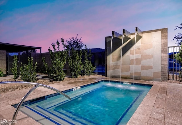 view of pool with fence