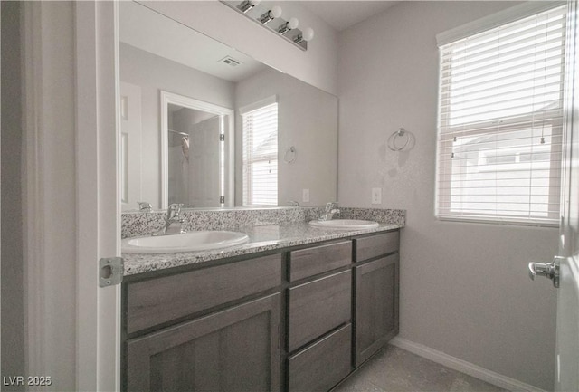 bathroom with walk in shower and vanity