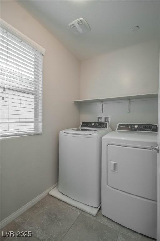 washroom with separate washer and dryer