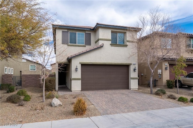 view of front of home with a garage and central AC unit