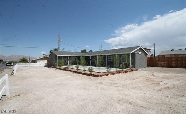 view of front of house with fence