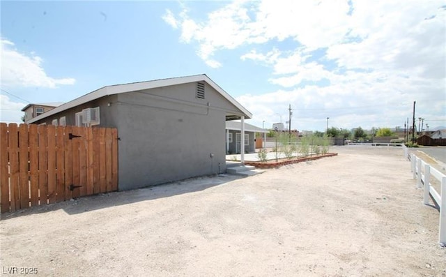 view of side of property with fence