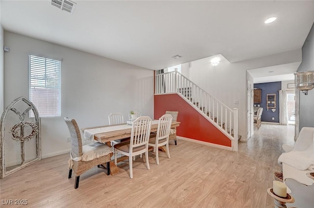 dining room with light hardwood / wood-style flooring