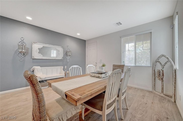 dining space featuring light wood-type flooring