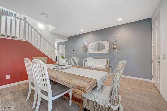 dining space featuring light hardwood / wood-style flooring