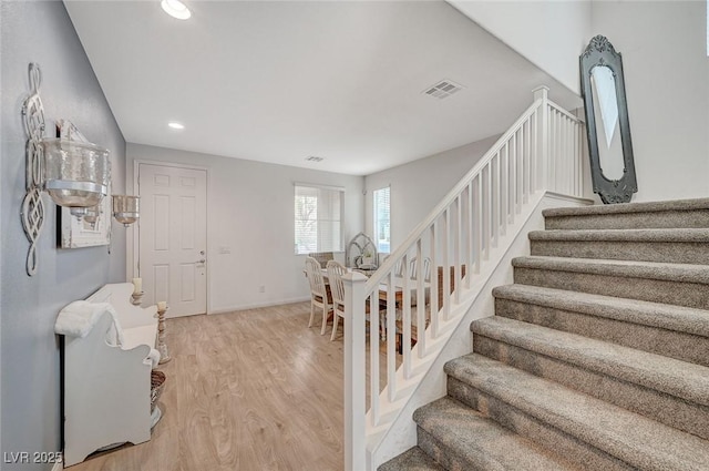 stairs with wood-type flooring