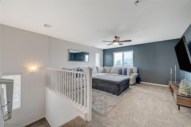 carpeted bedroom with ceiling fan