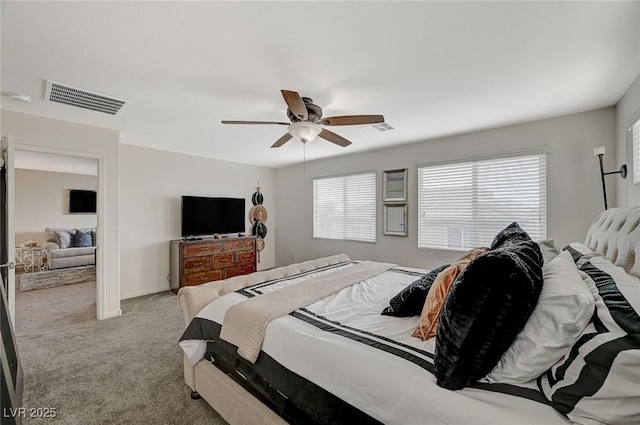 carpeted bedroom featuring ceiling fan