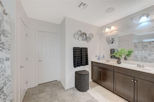 bathroom with vanity and tile patterned floors