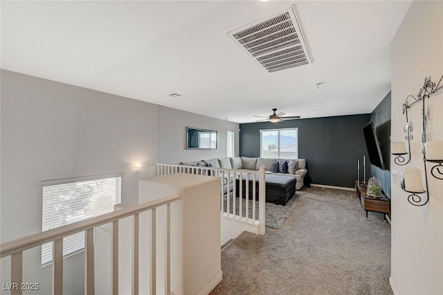 hallway with carpet floors