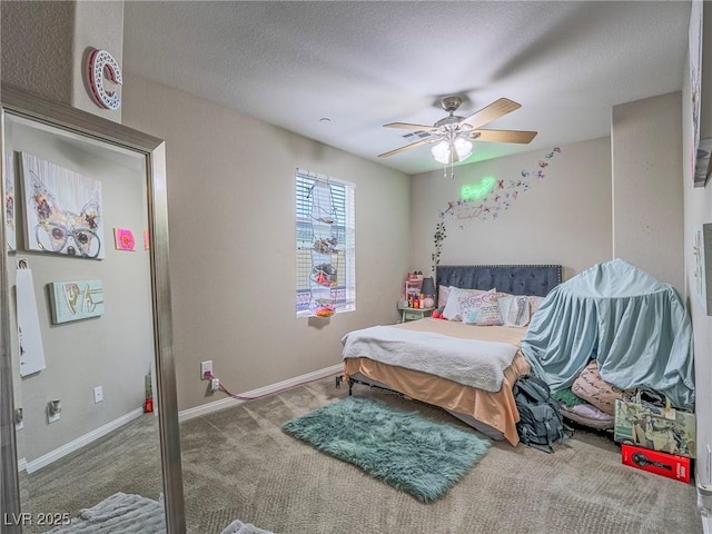 bedroom with ceiling fan, a textured ceiling, and carpet flooring