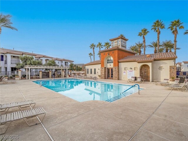 view of pool with a pergola and a patio area