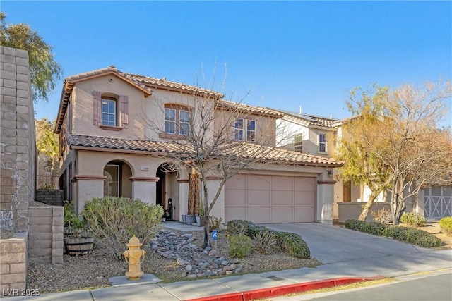 mediterranean / spanish-style house featuring a garage