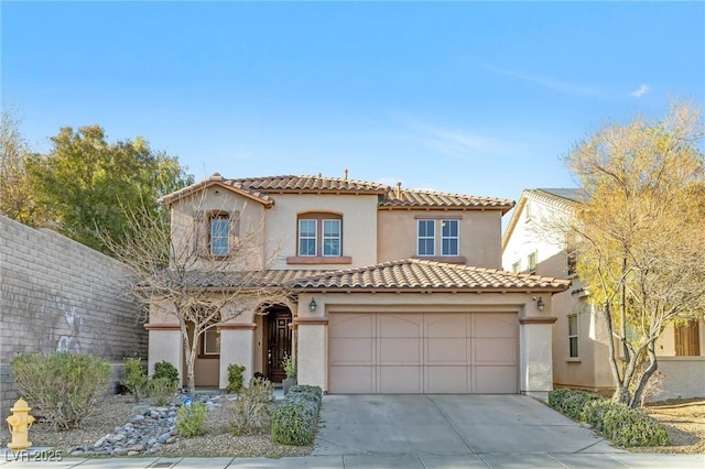 mediterranean / spanish-style house featuring a garage