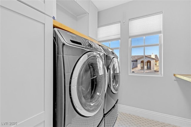 laundry room with washer and dryer