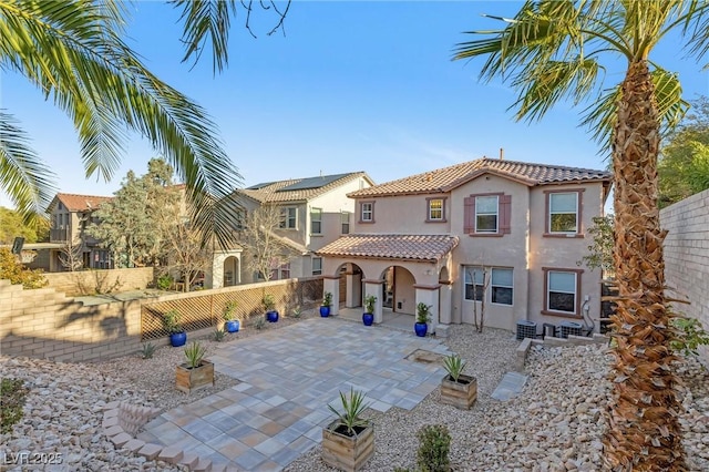 back of house with a patio area